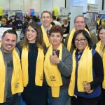 group of professionals giving thumbs up at school choice fair